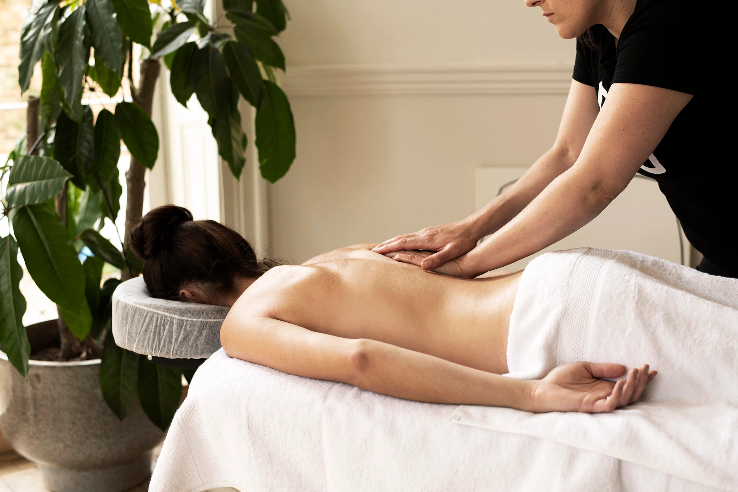 How can massage help to relieve back pain?